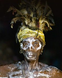 Batwa pygmy woman painted body visited on trip to D. R. Congo