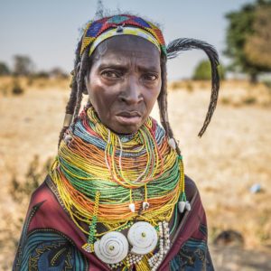 meeting with Plain Muila woman wearing traditional costume during ethnographic trip to Angola