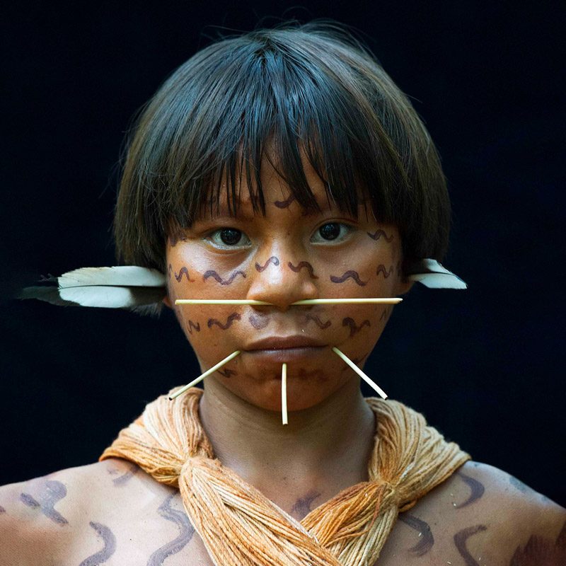 Yanomami woman wearing traditional wooden piercings