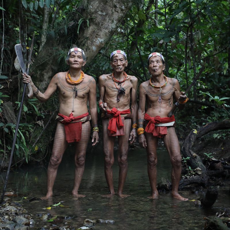 meeting with mentawai men in forest during ethnographic trip to Siberut Indonesia